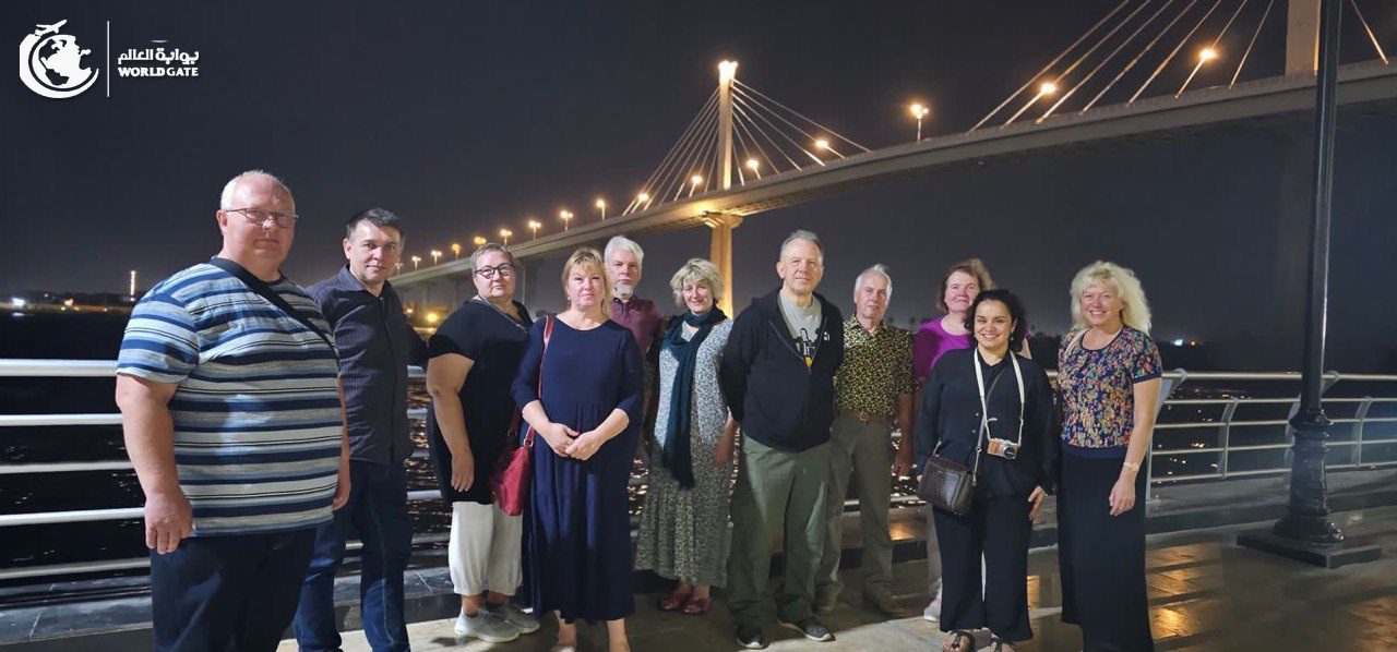Tour group by the river in Basra at night